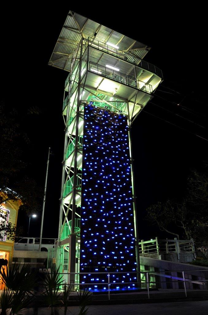 Outdoor climbing tower with led climbing holds at night