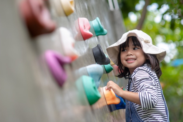 little girl climbing outside